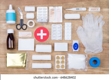 First Aid Kit On Wooden Background, Top View