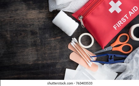 First aid medical kit on wood background,copy space,top view