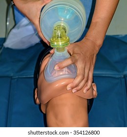 First Aid Resuscitation (CPR), Cardiac Arrest Or Respiratory Being Resurrected With The Help Of A Manual Respirator. Ideal For Training Materials