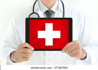 First aid sign on tablet pc screen held by doctor - Powered by Shutterstock