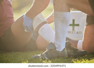 First aid, sport injury and hands on leg with rugby accident, fitness and massage on a field. Training, workout and physical therapy of knee pain at game with healthcare emergency from exercise - Powered by Shutterstock