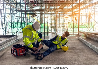 First aid support accident in site work, Builder accident fall scaffolding to the floor, Safety team help employee accident.