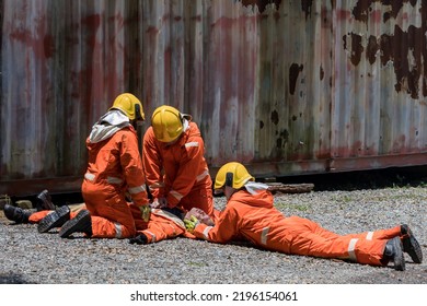 First aid support accident at work. Firefighter to save girl in fire and smoke. Rescue Team or Firefighters save lives people from fire. Firefighter or Emergency team  rescue saving life people  - Powered by Shutterstock