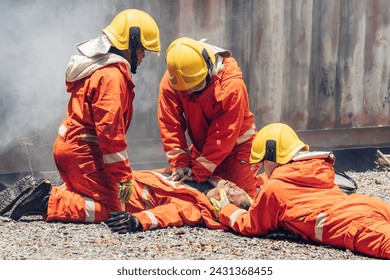 First aid support accident at work. Firefighter to save girl in fire and smoke. Rescue Team or Firefighters save lives people from fire. Firefighter or Emergency team rescue saving life people	 - Powered by Shutterstock