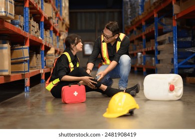 First aid support accident at work of worker at factory. Male worker has an accident on the floor in warehouse site