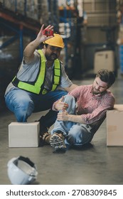 First aid support accident at work of worker at factory. Male worker has an accident on the floor in warehouse site	