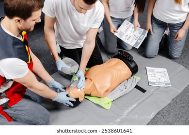 First Aid Training - Cardiopulmonary resuscitation. First aid course on cpr dummy - Powered by Shutterstock