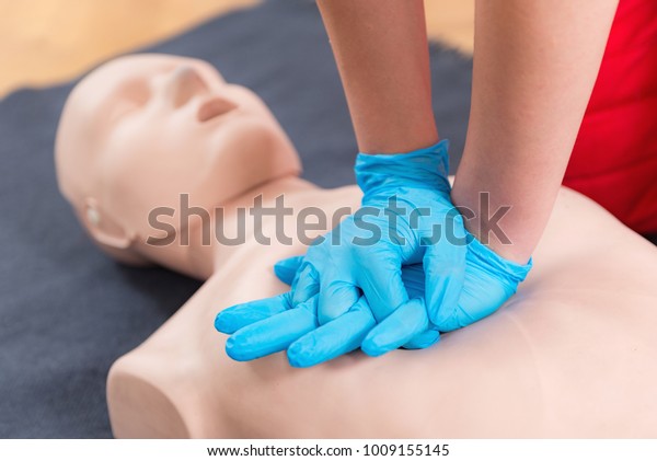 First Aid Training - Cardiopulmonary\
resuscitation. First aid course on cpr\
dummy.