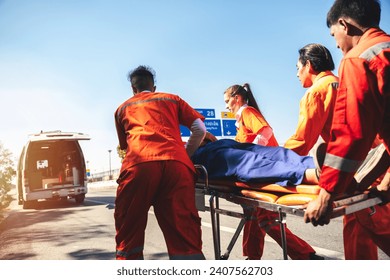 First Aid Training, Emergency Rescue Team Holding Transfer Stretcher to Help Patient in Emergency Situation. Critical Medical Assistance and Rescue Services in Action | Emergency Response Team. - Powered by Shutterstock