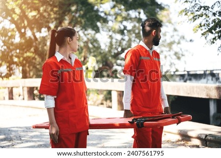 First Aid Training, Emergency Rescue Team Holding Transfer Stretcher to Help Patient in Emergency Situation. Critical Medical Assistance and Rescue Services in Action | Emergency Response Team. ストックフォト © 