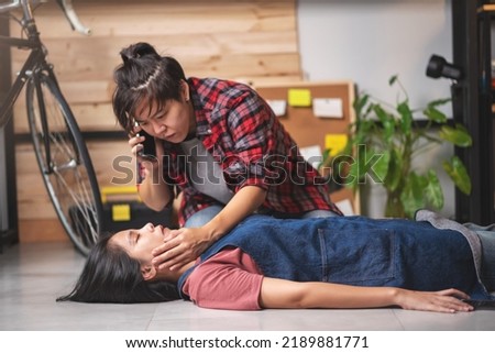 First aids emergency CPR on heart attack woman laying unconscious in home, One part of the process resuscitation - healthcare and insurance concept.