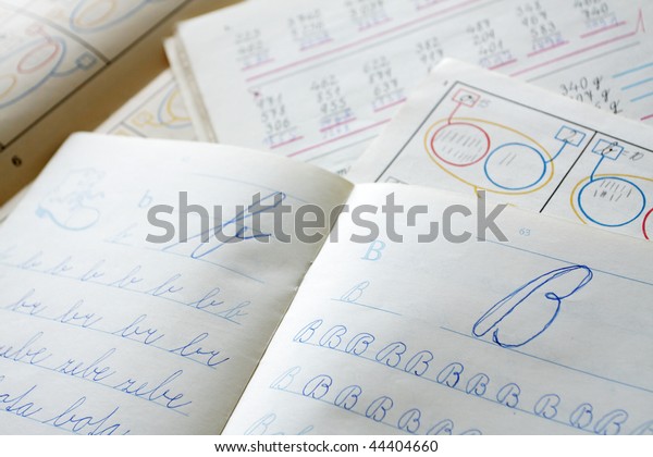 first alphabet writing\
in exercise book