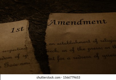 First Amendment text of the US Constitution ripped in half -- Freedom of Speech , Religion or Press  unconstitutional concept                               