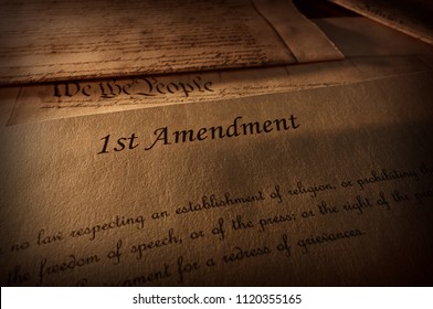 First Amendment of the US Constitution text, with other Constitution text above                                