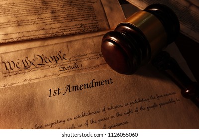 First Amendment and US Constitution text with legal gavel                               