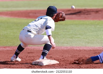 A First Baseman Is Catching A Ball