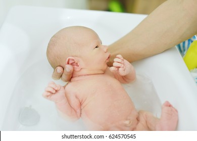 The First Bathing Of Newborn At Home