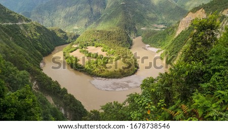 First bend of Nu river (Salween) in Bingzhongluo Tibetan village. Three Parallel Rivers of Yunnan Protected Areas (World Heritage) in Gongshan, Nujiang, Yunnan, China.