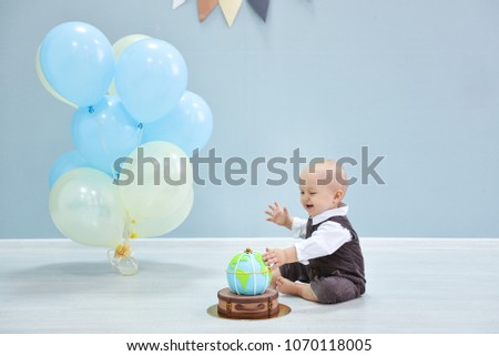 first birthday. smash the cake, a thematic birthday - a travel, trip. globe.