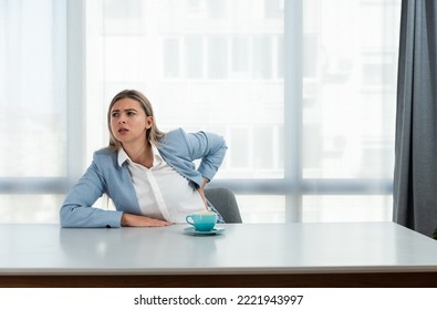 But First Coffee. Young Unhappy Tired Business Woman In Formal Wear Sitting In The Office At Empty Desk With Cup Of Coffee. Female White Collar Worker, Freelancer Financial Expert Morning Routine.