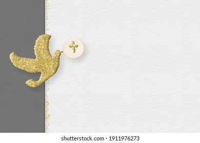 First communion invitations cards backgrounds.Gold glitter dove on a on white and gray paper background with copy space.