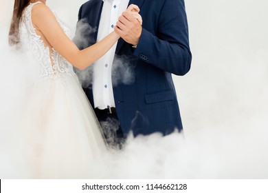 First Dance At The Wedding. Pair Dancing In The Fog, Holding Hands. Father And Daughter Dance