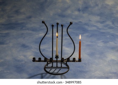 First Day Of Hanukkah With Burning Hanukkah Candles In Menorah