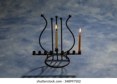 First Day Of Hanukkah With Burning Hanukkah Candles In Menorah