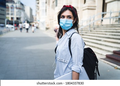 First Day Of School. Female Student Wearing Protective Face Mask Walking Around College During Pandemic. University Background.