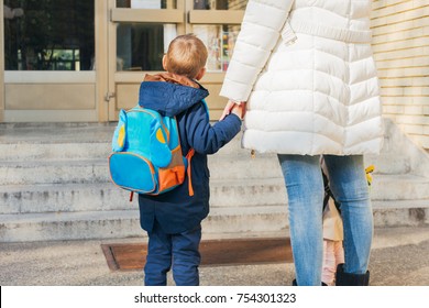 First Day Of School, Little Boy And His Mom Standing In Front Of School's Door, Closeup