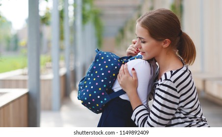 First Day At School. Mother Leads A Little Child School Girl In First Grade
