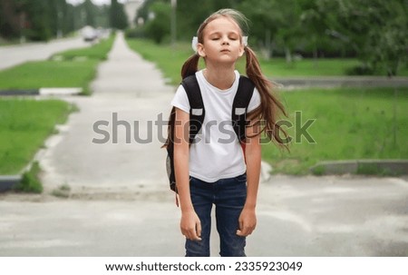 first day of school. student girl primary school is upset and does not want to go to class. The first day of autumn. concept back to school.