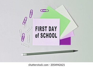 First Day Of School - Text On Sticky Note Paper On Gray Background. Closeup Of A Personal Agenda. Top View. Conceptual Photo