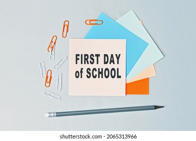 First Day Of School - Text On Sticky Note Paper On Gray Background. Closeup Of A Personal Agenda. Top View. Conceptual Photo