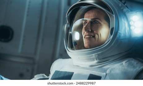 First Female Astronaut Landed on the Moon. Close Up of a Beautiful Female Astronaut Standing in Space, Looking at Planet Earth. Blue Planet Reflecting in Her Helmet. Space Travel Concept - Powered by Shutterstock