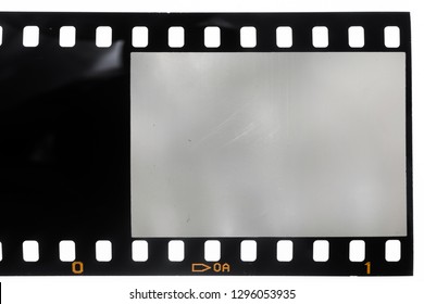 first frame of 35mm film material, empty photo frame with small scratches and signs of usage isolated on white background, just drop in you own content