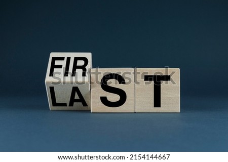 First or Last. Cubes form the words First or Last. Business success concept