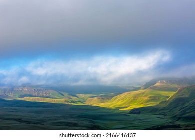 First Light Of The Day Break Through The Clouds Drakensberg South Africa