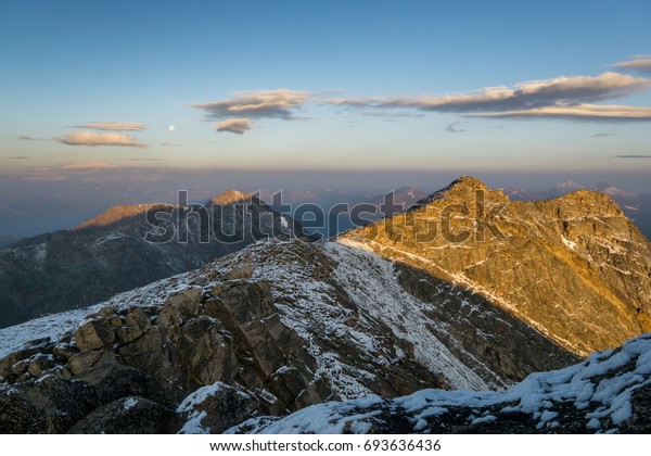 First light on Mount Evans, and Mount\
Bierstadt; two of Colorado\'s\
fourteeners.