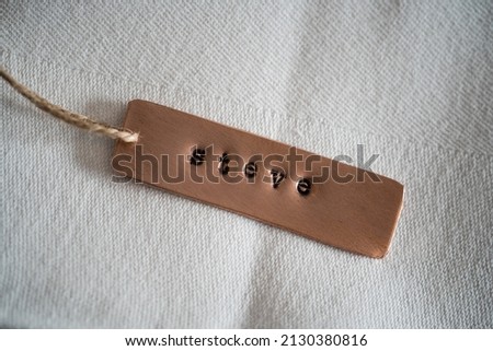 First name Steve identity engraved name dog tag copper metal name plate badge. Shiny and clean stamped letters on retro trinket pendent. Short for Steven or Stephen.
