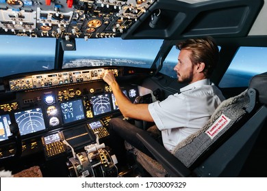 First Officer Is Controlling Autopilot And Parameters For Safety Flight. Cockpit Of Boeing Aircraft. Content Is Good Any Airline.