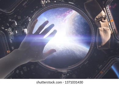 first person view of person cover from light in the window on spacecraft, elements of this image furnished by nasa - Powered by Shutterstock