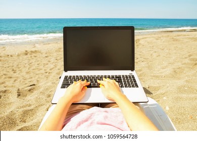 First Person View. Female Blogger Hands Close Up, Typing On Laptop Computer Blank Screen, Keyboard, Writing Blog Entry. Young Woman Programmer Coding, Notebook At Sea Beach. Perks Of Freelance Concept