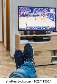 First Person View Of A Man Watching A Basketball Game On Tv