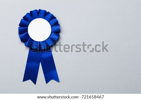 First place award rosette with blank white centre.  Success achievement concept