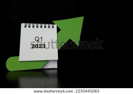 First quarter of 2023 positive growth performance financial report and fiscal concept. Upward arrow with increasing coins and calendar in black background.
