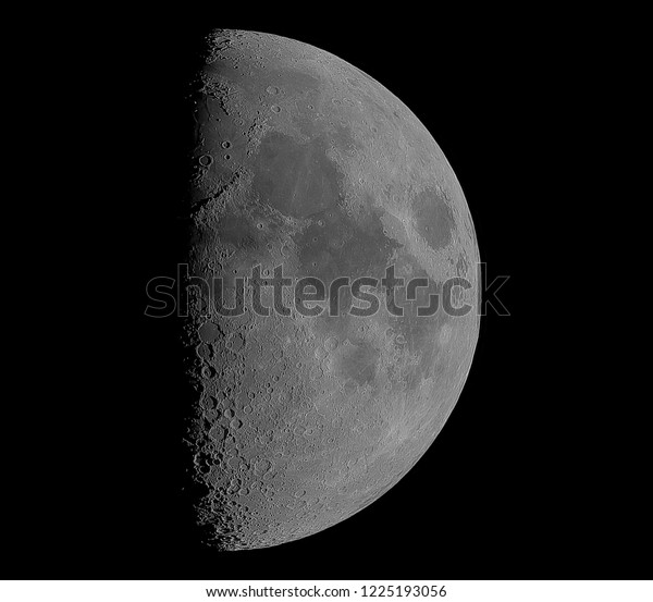 First quarter moon\
with detail. Real photo.