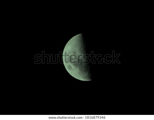 First Quarter Moon, with light highlighting its\
relief, seen in the southern hemisphere at night - POA, SAO PAULO,\
BRAZIL.