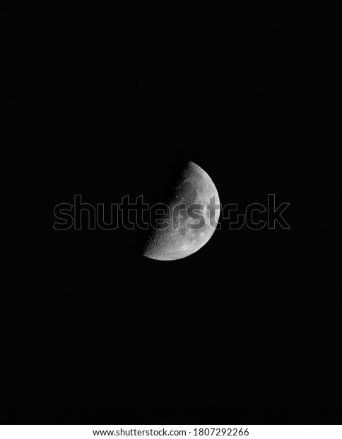 First Quarter of\
the Moon on Black\
Background