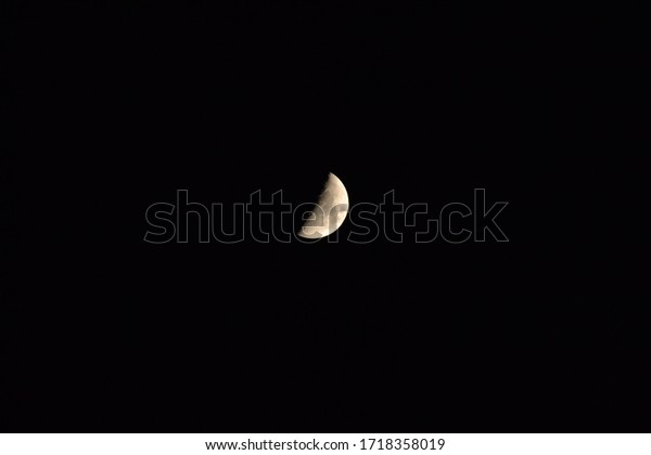 FIRST QUARTER OF
THE MOON ON A PURE NIGHT
SKY